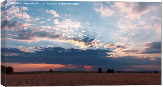 A great storm cloud closed the setting sun Canvas Print by Sergii Petruk
