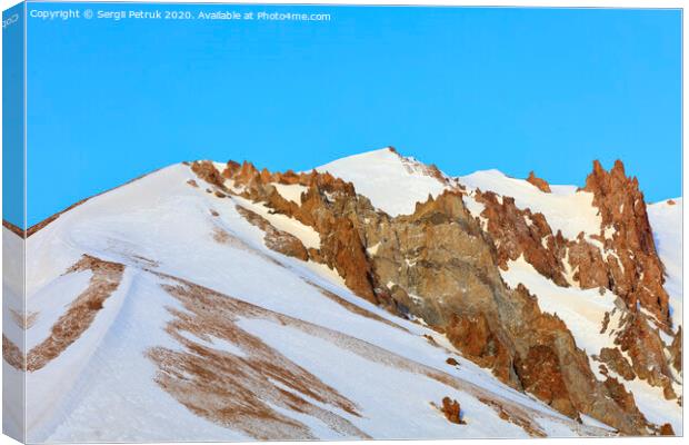 Strict and majestic peaks of Mount Erciyes on a clear sunny day in central Turkey. Canvas Print by Sergii Petruk