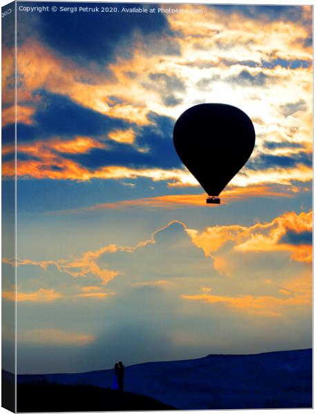 Silhouette of a loving couple and balloon against the morning sky with fiery red clouds Canvas Print by Sergii Petruk
