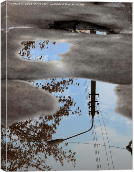 Reflection of the sky, the silhouette of a street lamp and a tree in a puddle on bad asphalt. Canvas Print by Sergii Petruk