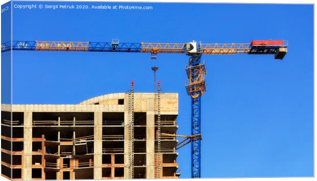 Facade and construction crane near the modern concrete building under construction. Canvas Print by Sergii Petruk