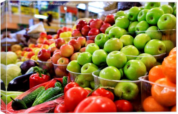Green, red, yellow apples, fruits and vegetables for sale in the market Canvas Print by Sergii Petruk