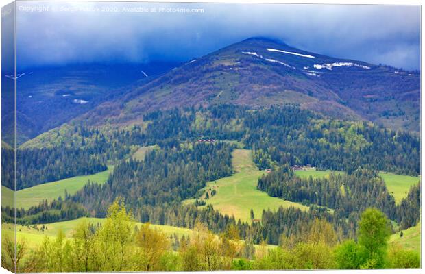 The landscape of the majestic mountain in the Carpathians along the slope of which the cable lift is laid. Canvas Print by Sergii Petruk