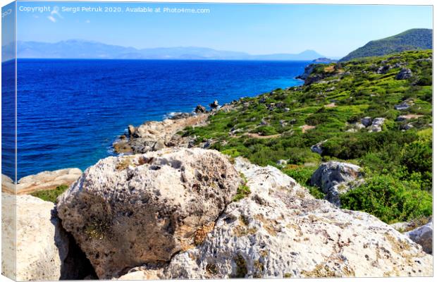 The coastline of the Ionian Sea is dotted with large stone boulders. Canvas Print by Sergii Petruk