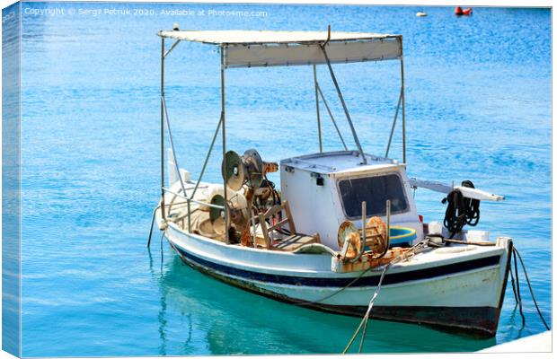 View of a small wooden fishing boat with fishing tackle. Canvas Print by Sergii Petruk