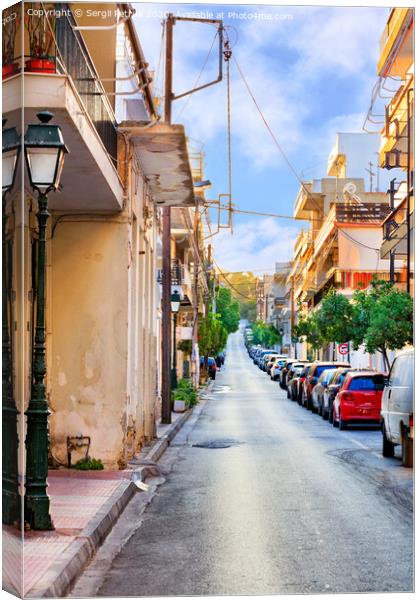 Deserted old narrow street of Loutraki in Greece in the early morning in the rays of the rising summer sun. Canvas Print by Sergii Petruk