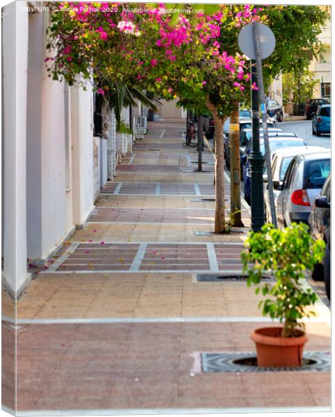 Deserted old sidewalk on Loutraki street in Greece on an early summer morning. Canvas Print by Sergii Petruk