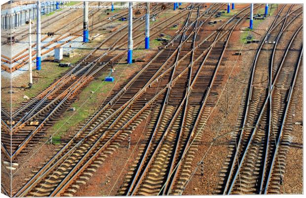 A powerful network of multi-channel railway tracks with a turn for the passage of electric trains. Canvas Print by Sergii Petruk