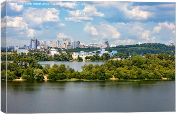 The beautiful cityscape of Kyiv with the Dnipro River and islands in the foreground and new high-rise buildings on the horizon. Canvas Print by Sergii Petruk