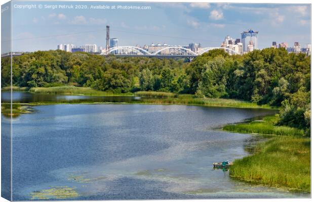 Natural picturesque landscape of the Dnipro bay near one of the river islands. An industrial city is visible in the background. Canvas Print by Sergii Petruk