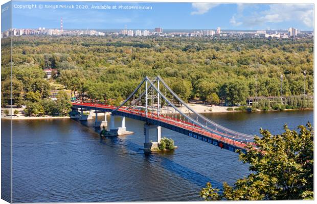 Pedestrian park bridge over the Dnipro river in Kyiv on a sunny summer day. Canvas Print by Sergii Petruk