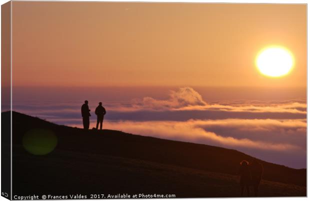 Two people silhouetted viewing the sunset and fog Canvas Print by Frances Valdes