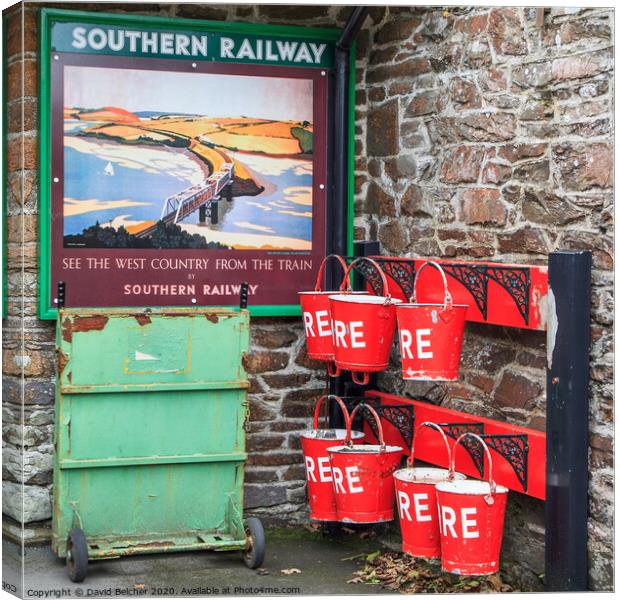 Fire bucket at Southern railway station Canvas Print by David Belcher