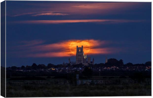 Harvest Moon rising behind Ely Cathedral Canvas Print by Andrew Sharpe