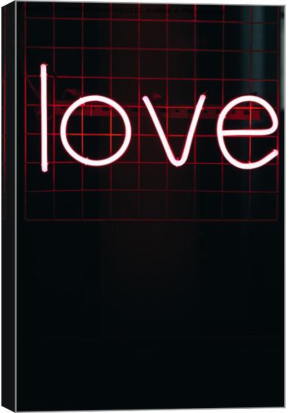 Red neon sign written love with copy space Canvas Print by Alexandre Rotenberg