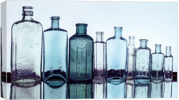 Line of Bottles Canvas Print by Kelly Bailey