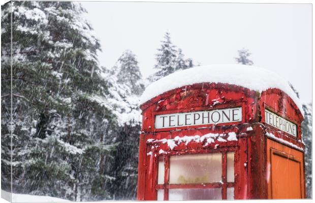 A British Red telephone box covered in snow Canvas Print by Tom Radford