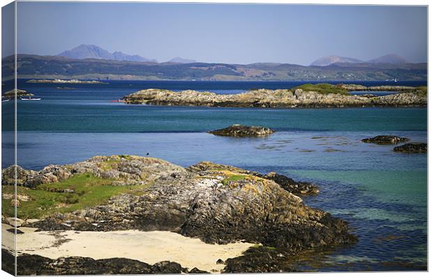 Rocky beach, Skye backdrop, West Scotland Canvas Print by Linda More