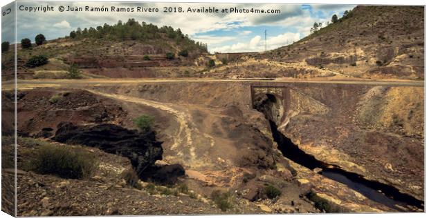 Big black rock and stone bridge in the mining comp Canvas Print by Juan Ramón Ramos Rivero