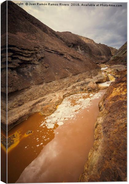 Orange acidic water with low PH between the cliff Canvas Print by Juan Ramón Ramos Rivero