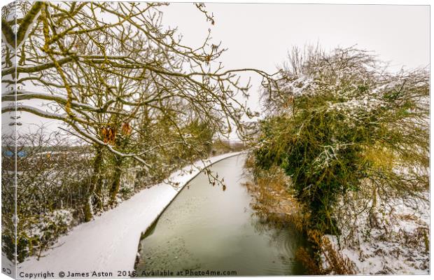 Snowy Canal Path Canvas Print by James Aston