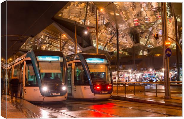 Barcelona trams at night Canvas Print by Andrew Michael