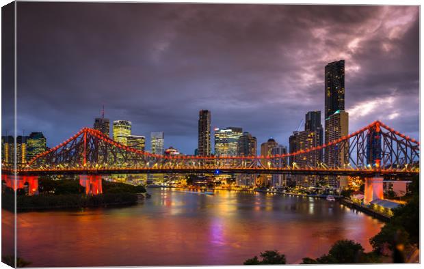 Story Bridge lit up after dark with Brisbane city  Canvas Print by Andrew Michael