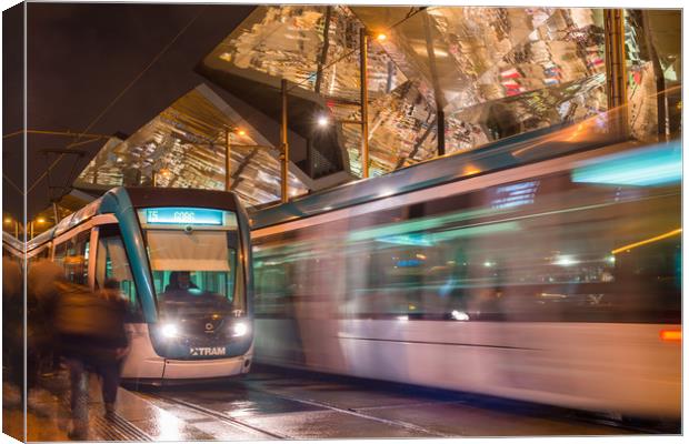 Night view of two trams at Glories station Canvas Print by Andrew Michael