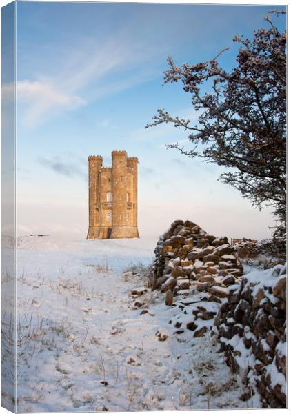 Broadway tower in winter snow.  Canvas Print by Andrew Michael