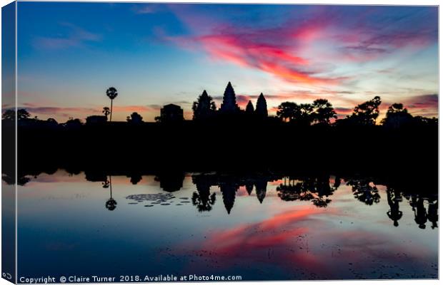 Pink sunrise at Angkor Wat Canvas Print by Claire Turner