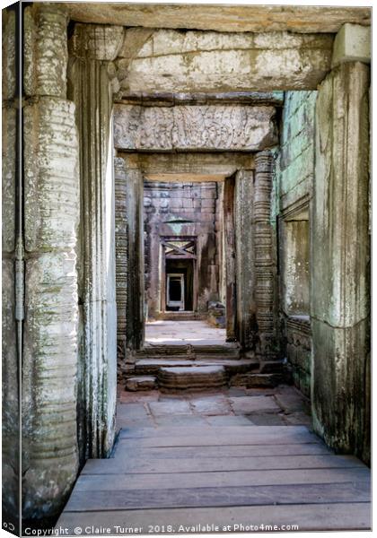 Repeating doorways in ruin Canvas Print by Claire Turner