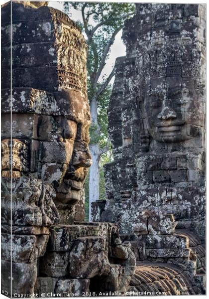 Faces of Bayon Canvas Print by Claire Turner