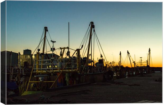 Silhouette of fishing boats Canvas Print by Clive Wells
