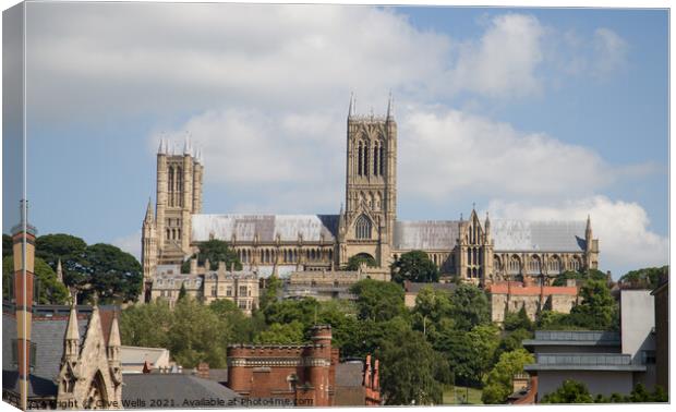 Lincoln Cathedral over the roof tops Canvas Print by Clive Wells