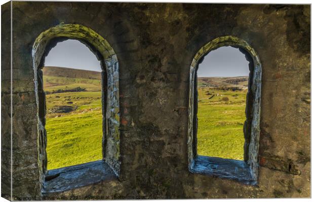 Looking through the arches Canvas Print by Clive Wells