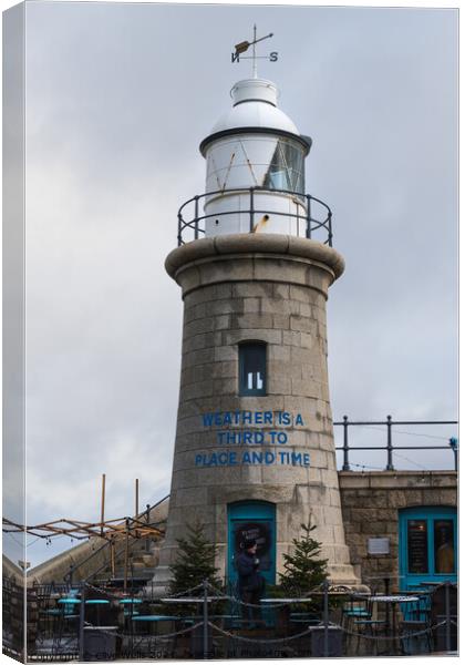 Lighthouse on the Harbour Arm Canvas Print by Clive Wells