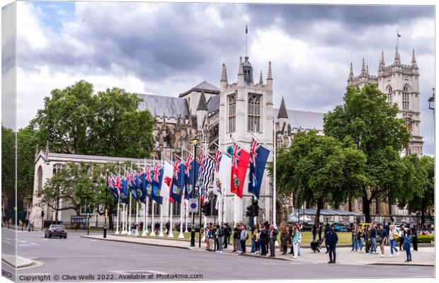 Flags in front of West Minister Cathedral. Canvas Print by Clive Wells