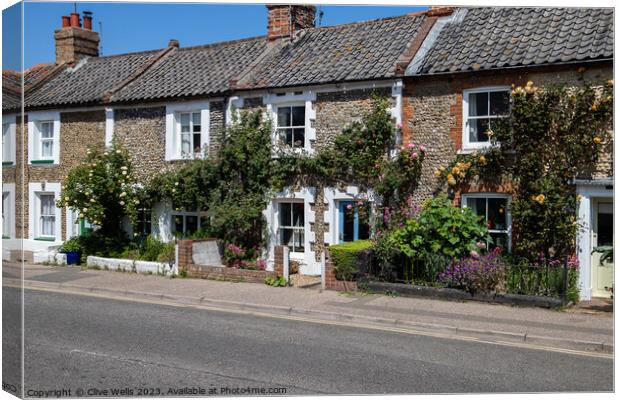 Lovely row of old cottages Canvas Print by Clive Wells