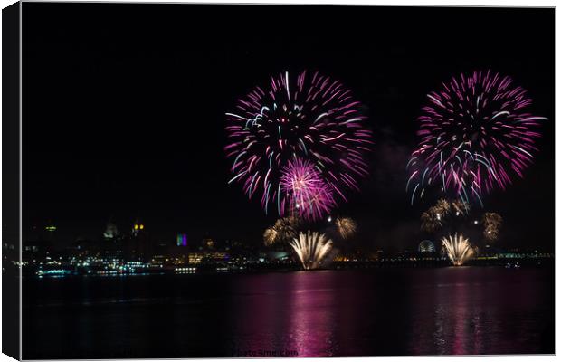 Waterfront fireworks over Liverpool Canvas Print by Clive Wells