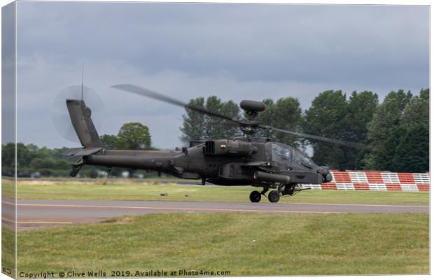 Apache Longbow taking off from RAF Fairford Canvas Print by Clive Wells