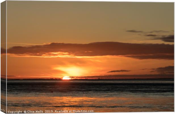 Sunset at Snettisham in Norfolk Canvas Print by Clive Wells