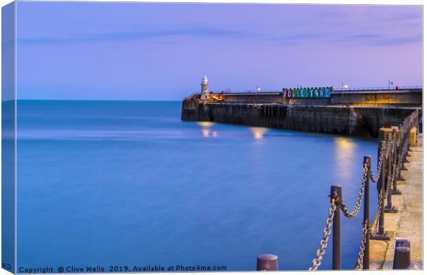 Folkestones Lighthouse at night Canvas Print by Clive Wells