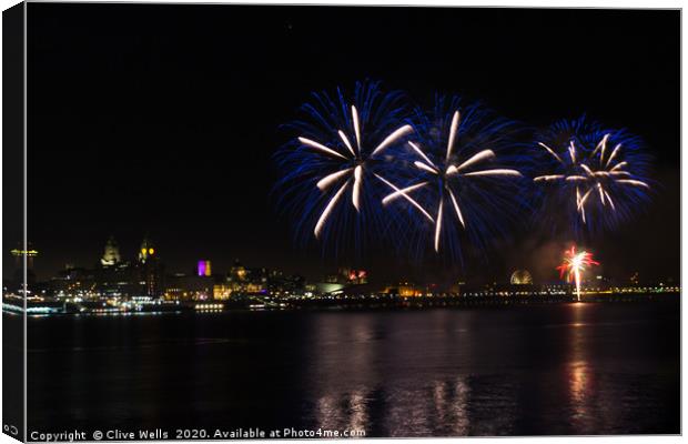 Fireworks high above Liverpool waterfront Canvas Print by Clive Wells