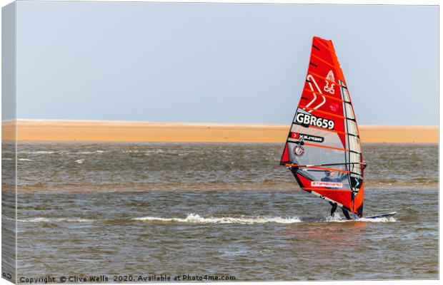 Wind surfing at Wells-Next-Sea in North Norfolk  Canvas Print by Clive Wells