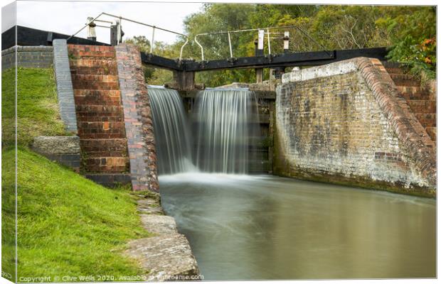 Close in of lock gates at Stoke Brurne. Canvas Print by Clive Wells