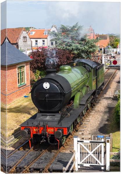 Steam train waiting. Canvas Print by Clive Wells