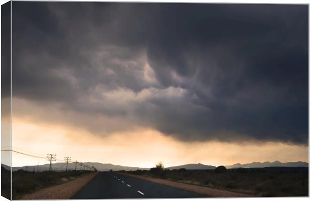 Road trip with stormy sky Canvas Print by Sue Hoppe