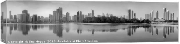 Sharjah Skyline reflected in water Canvas Print by Sue Hoppe