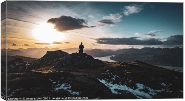 Man standing at the top of Ben Venue, Scotland in  Canvas Print by Ryan Brown