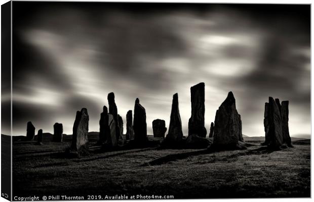 Sunset over the  Callanish Standing Stones Canvas Print by Phill Thornton